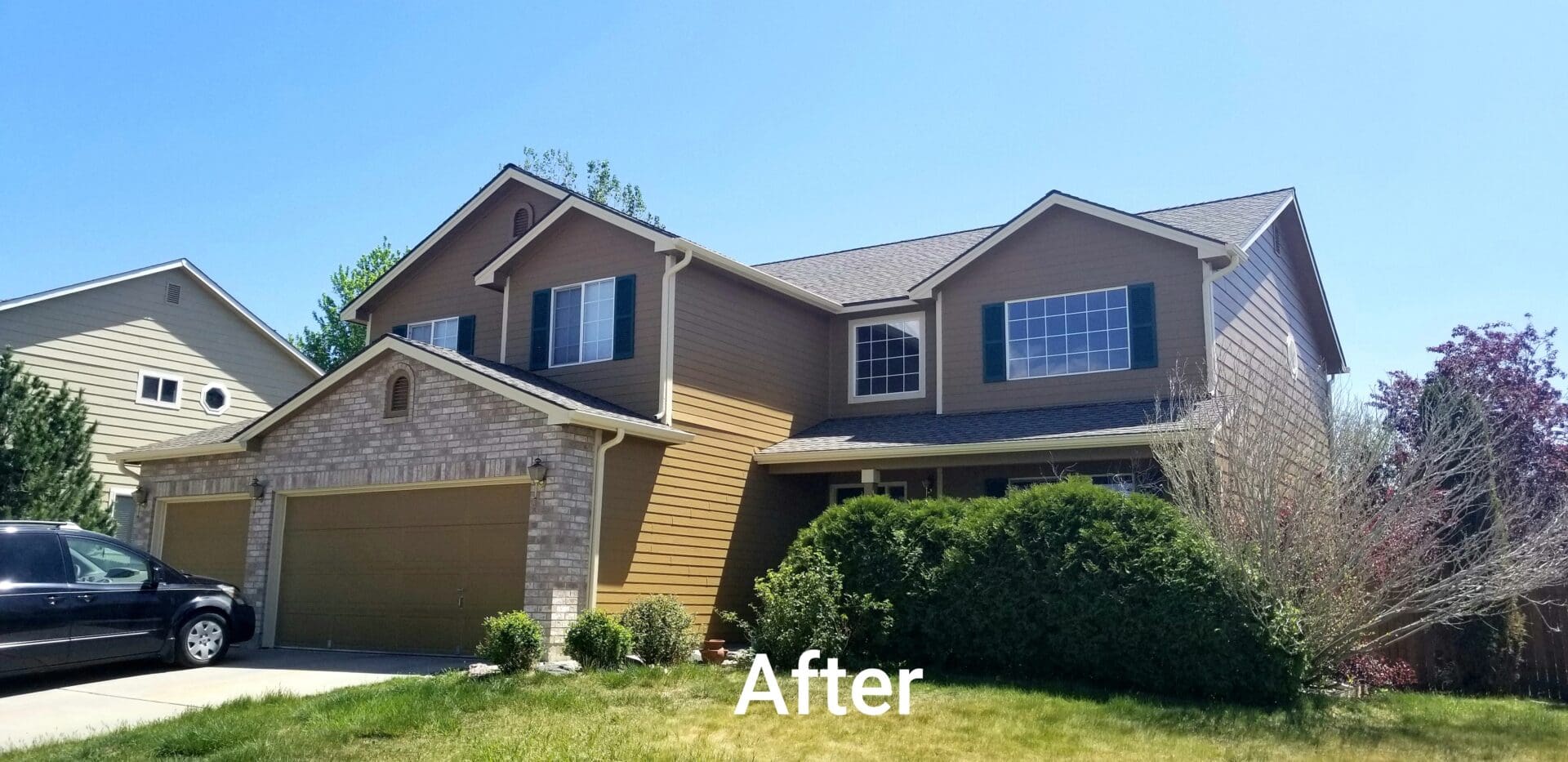 A house that has been painted and is being cleaned.