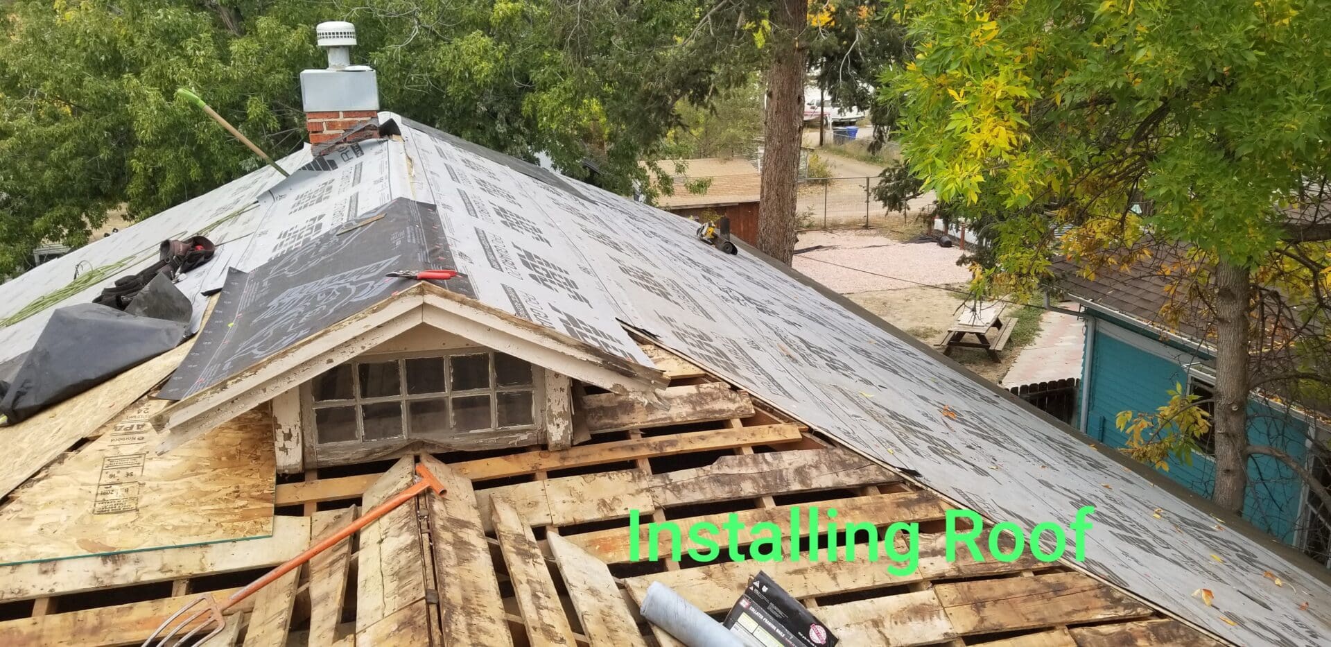 A roof that has been torn off of the house.