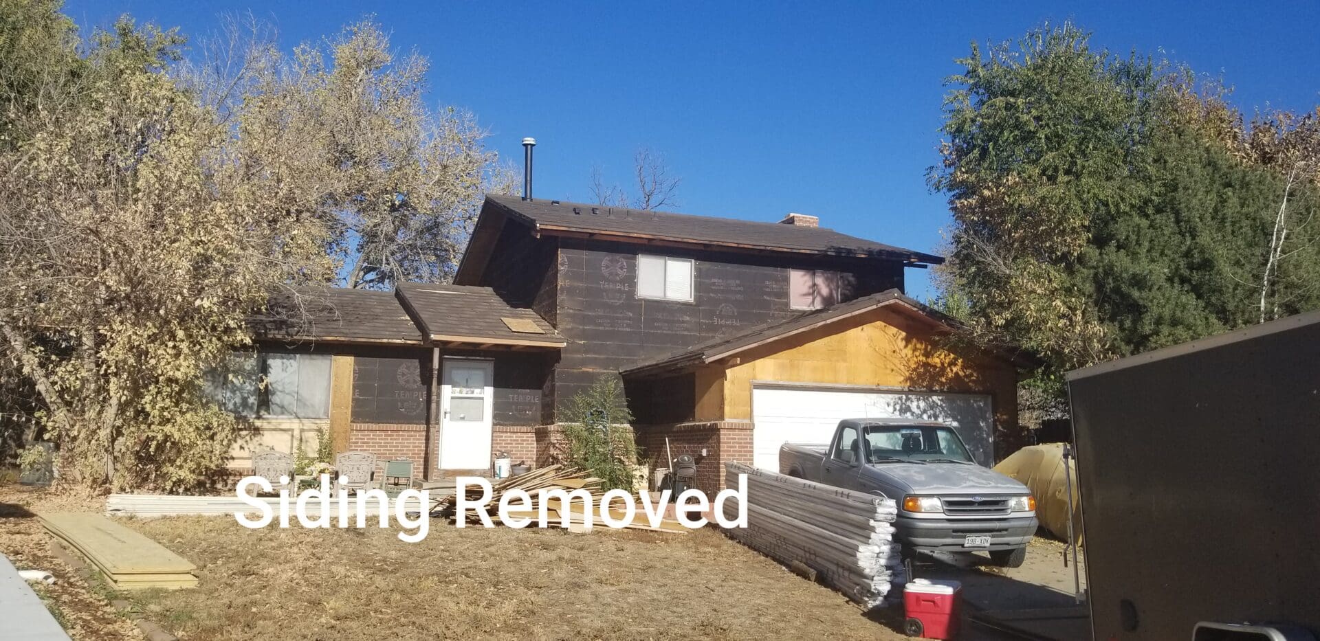 A house with its siding removed.