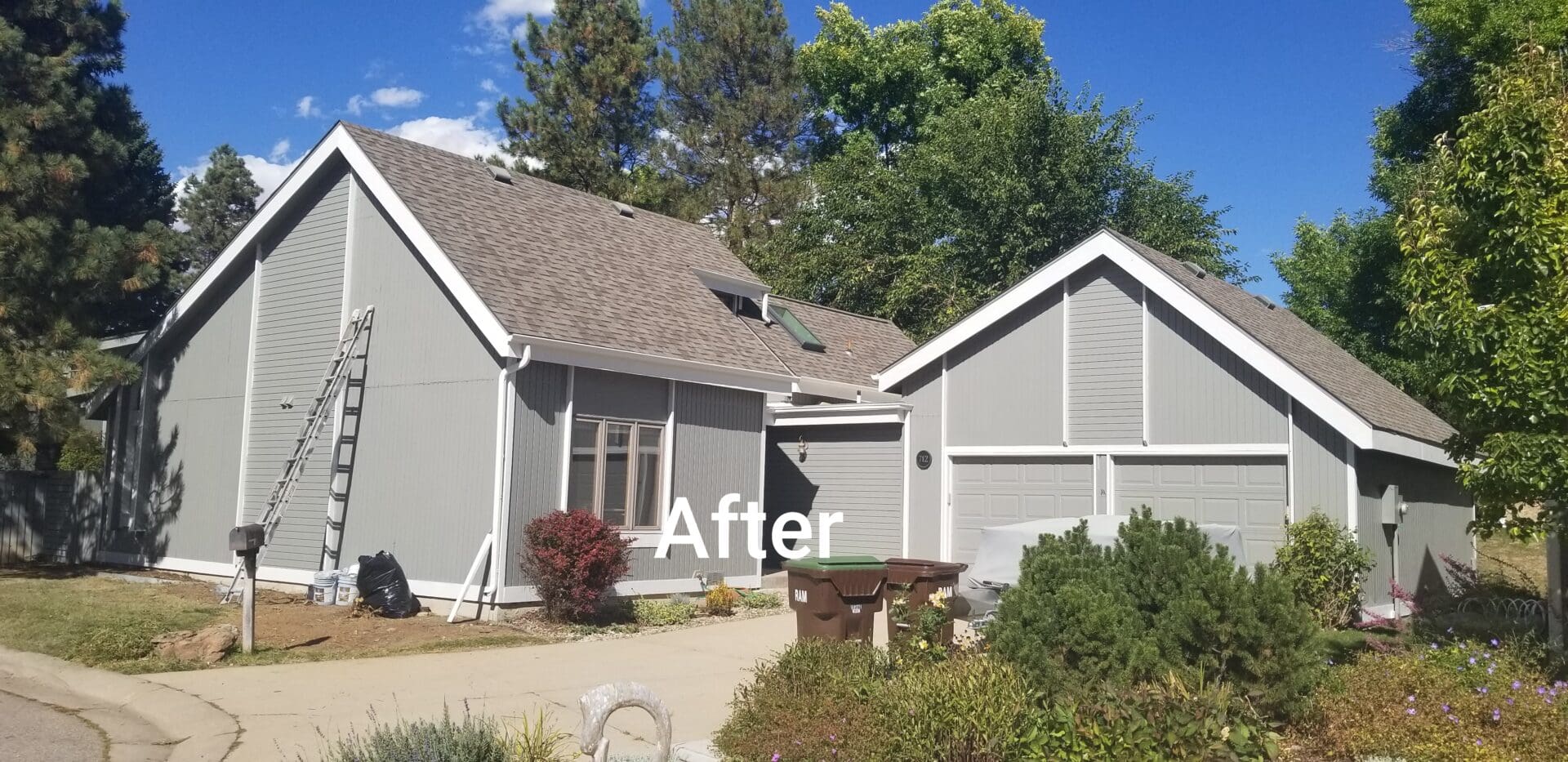 A house with gray siding and a gray roof.