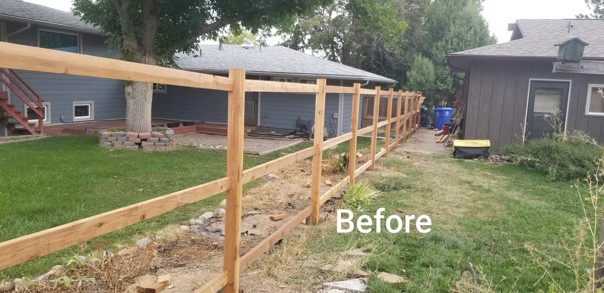 An old wooden fence is in the backyard.