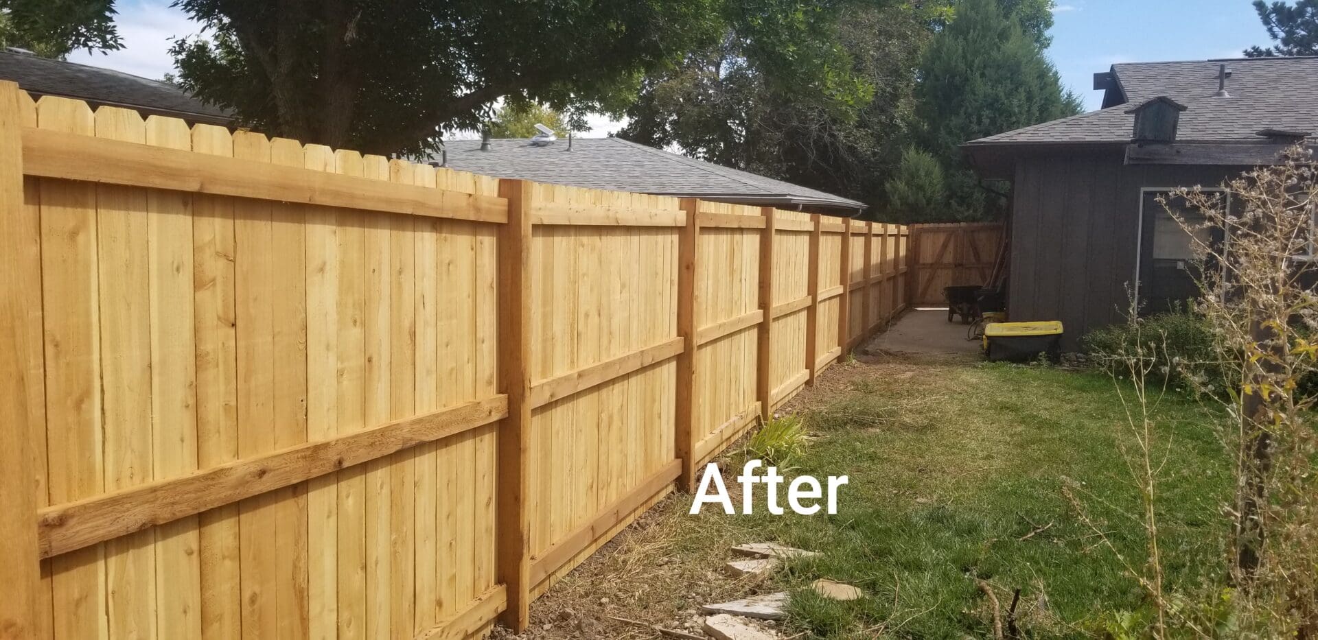 A wooden fence stained a golden brown color.